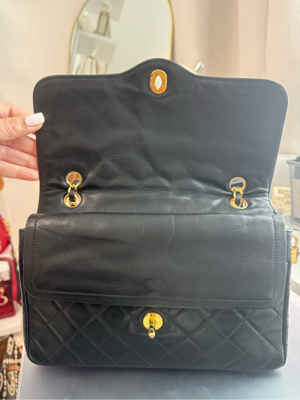CHANEL Black Quilted Leather Shoulder Bag with Gold Chain Strap